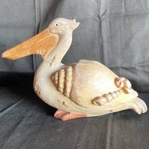Resin pelican decorated with shells